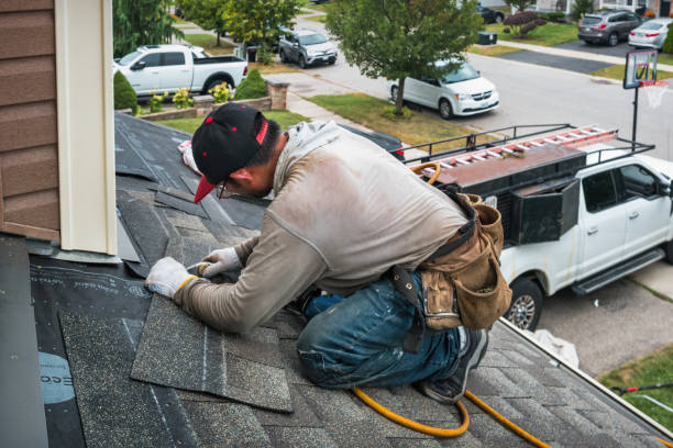 Professional Roofing technician working in Gill, MA
